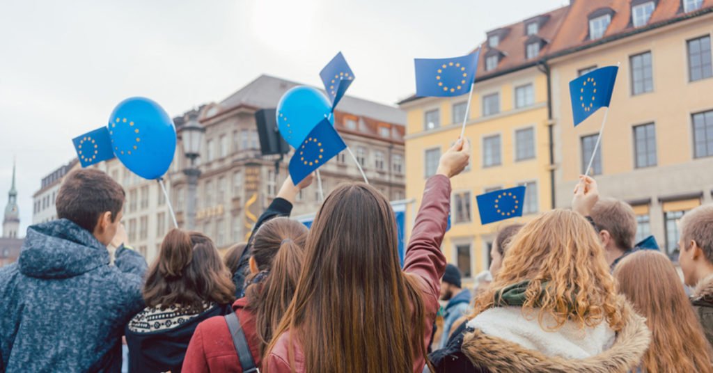 People on rally or demonstration supporting the EU waving flags